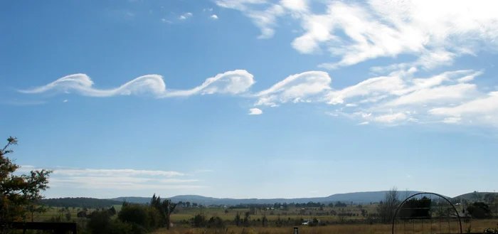 Wave clouds from Kelvin-Helmholtz instabilities forming over Mount Duval, NSW in Australia. Courtesy GRAHAMUK, via Creative Commons Attribution-Share Alike 3.0 Unported