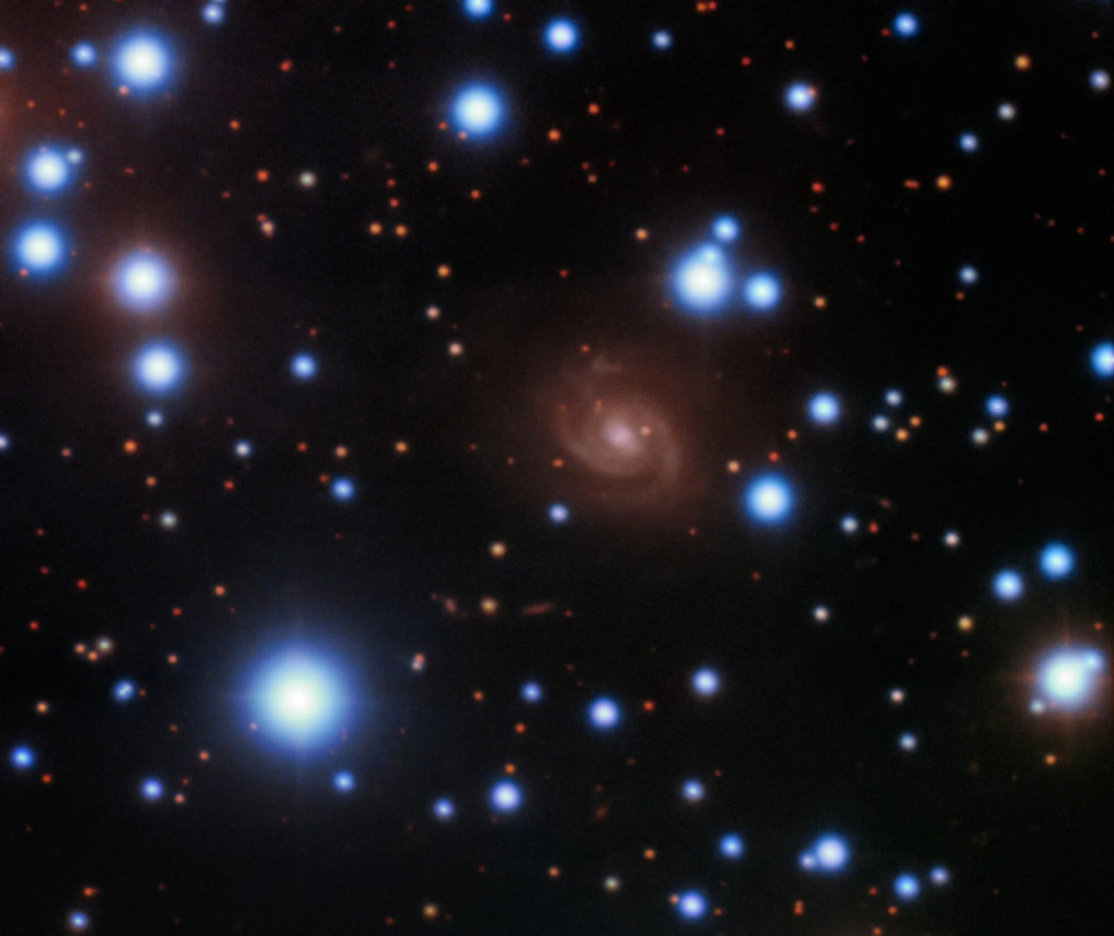 Image of the host galaxy of FRB 180916 (center) acquired with the 8-meter Gemini-North telescope of NOIRLab on Hawaii’s Maunakea. Credit: Gemini Observatory/NOIRLab/NSF/AURA