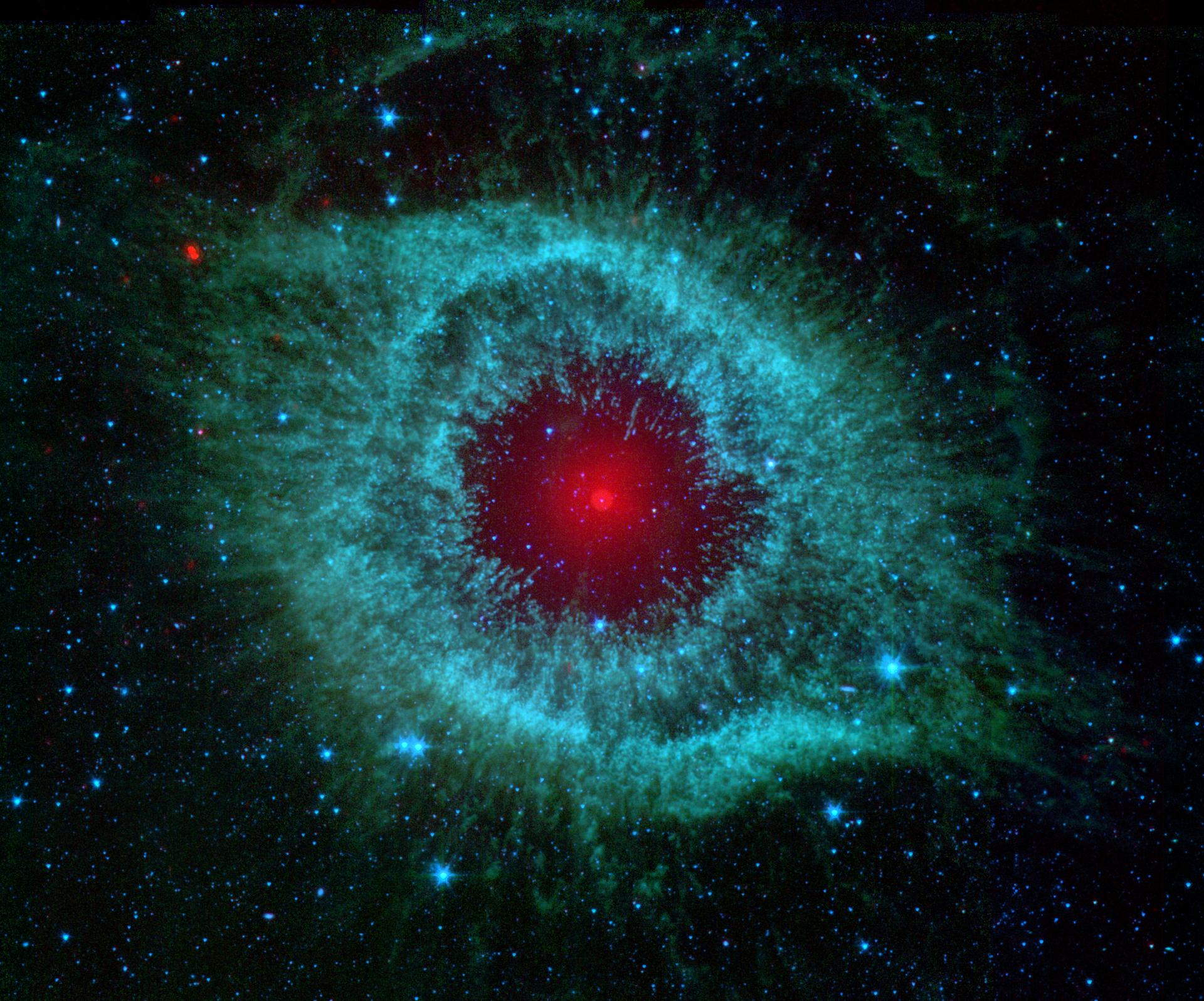 Comets Kick up Dust in Helix Nebula - NASA/JPL-Caltech/Univ.of Ariz.
