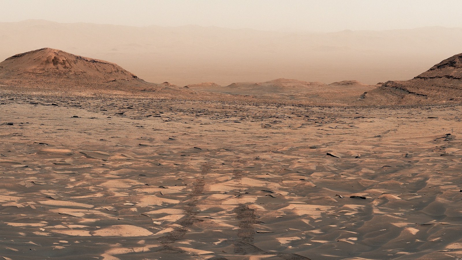 a reddish orange dusty landscape