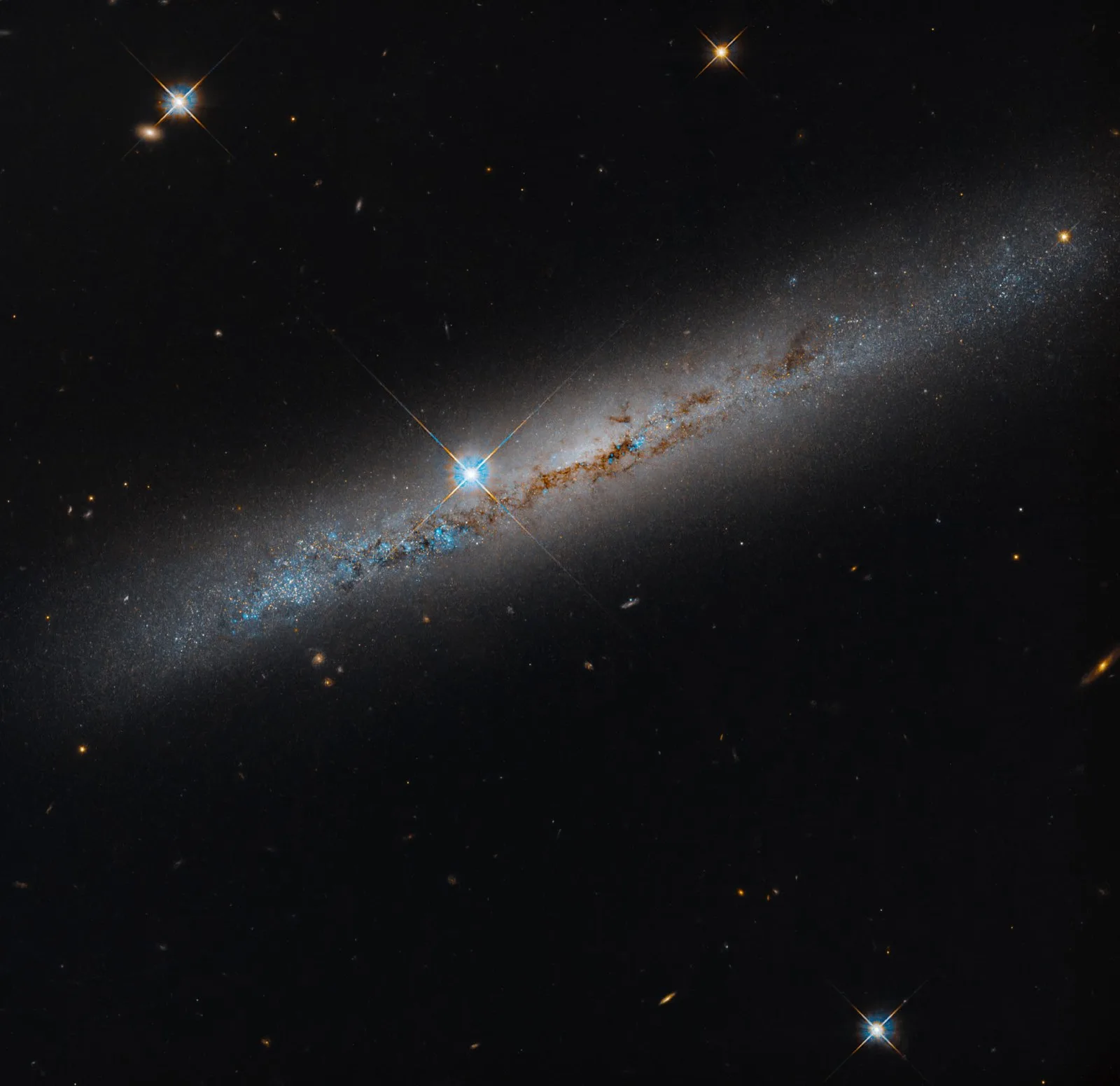 This Hubble image shows the edge-on, intermediate spiral galaxy NGC 1827. Image credit: NASA / ESA / Michael Jones, California Institute of Technology / Gladys Kober, NASA / Catholic University of America.