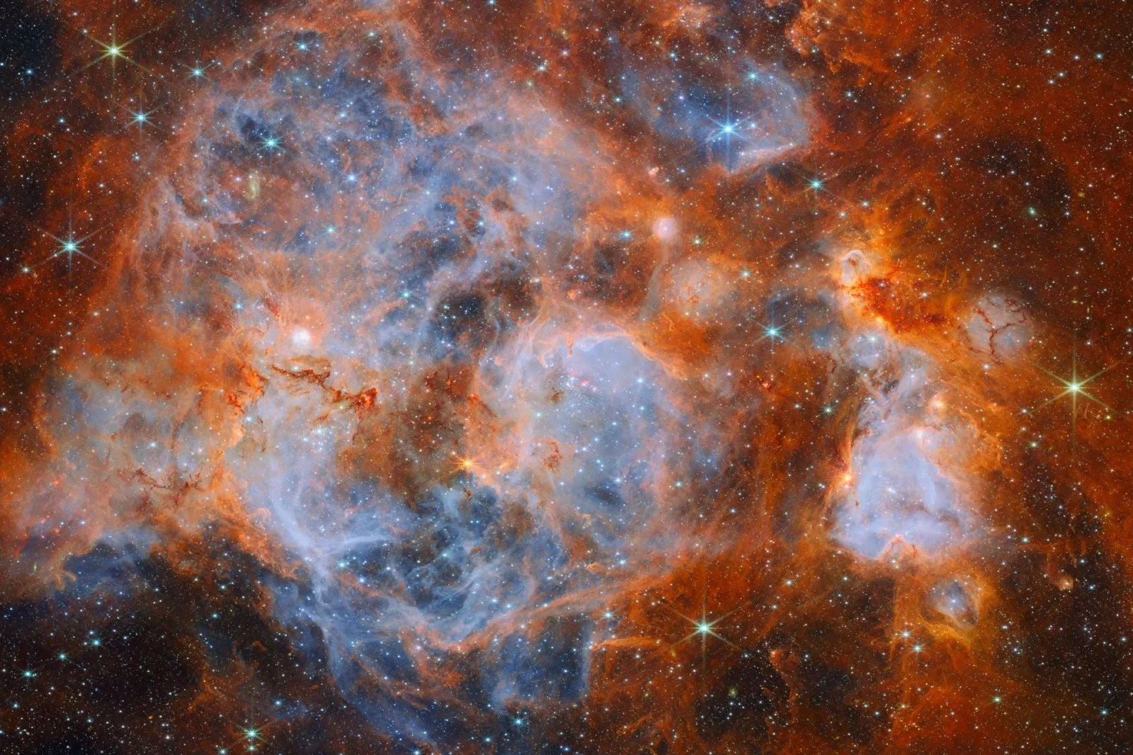 This Webb shows N159, a star-forming region within the Large Magellanic Cloud. Image credit: NASA / ESA / CSA / Webb / E. Sabbi / M. Zamani, ESA & Webb / M.H. Özsaraç.