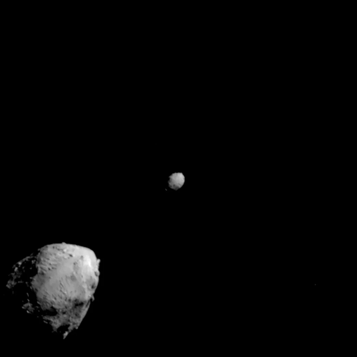 Didymos (lower left) and Dimorphos, imaged by the DART spacecraft, shortly before impact. Credit: NASA