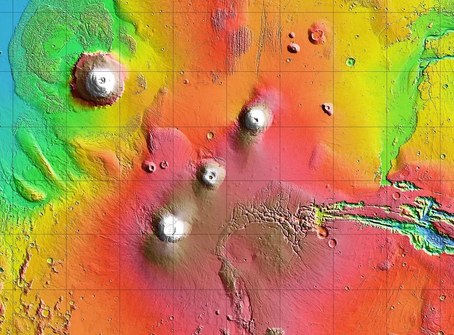 Tharsis Montes, with Olympus Mons (upper left) and Valles Marineris (right). Credit: NASA/JPL-Caltech