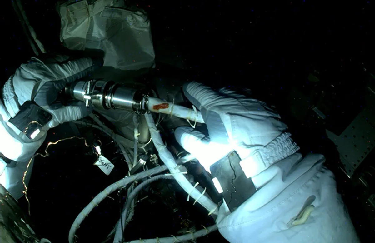 The astronauts had to make cable connections between the space station's power system and the new solar array while the complex was in orbital darkness. Image: NASA.