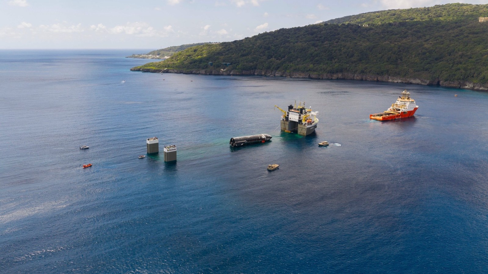 SpaceX loads the upper stage that flew on Starship's 13th test flight onto a "semi-submersible" ship off Christmas Island. The company posted this photo on X on Aug. 27, 2026.