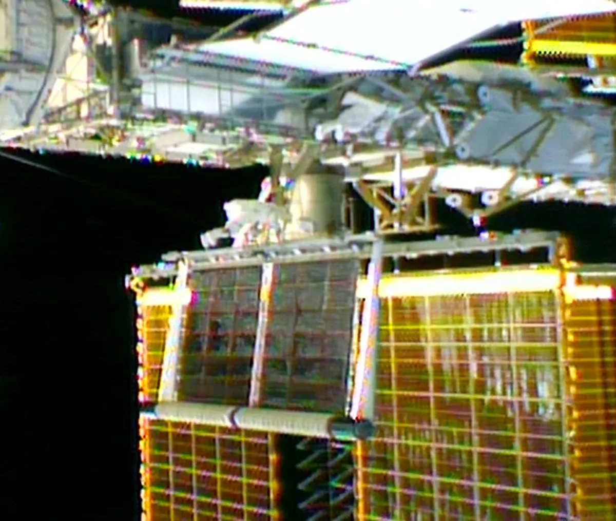 The IROSA solar array unrolls under during the Oct. 29 spacewalk under the watchful eye of astronaut Anil Menon. Image: NASA.