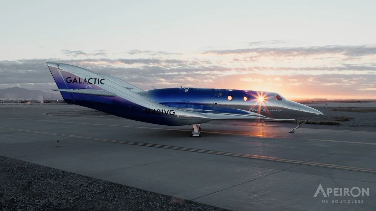 A space plane seen from the side sitting on a runway.